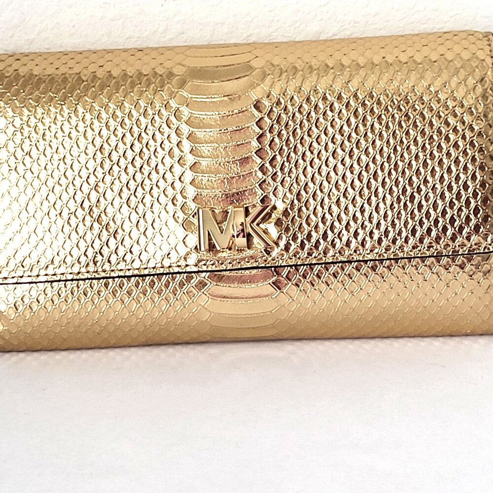 Michael Kors Mott Clutch Wallet in a metallic gold snake-embossed leather